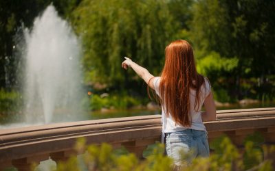 shallow-focus-photo-of-woman-standing-in-front-of-body-of-1174986 shallow-focus-photo-of-woman-standing-in-front-of-body-of-1174986